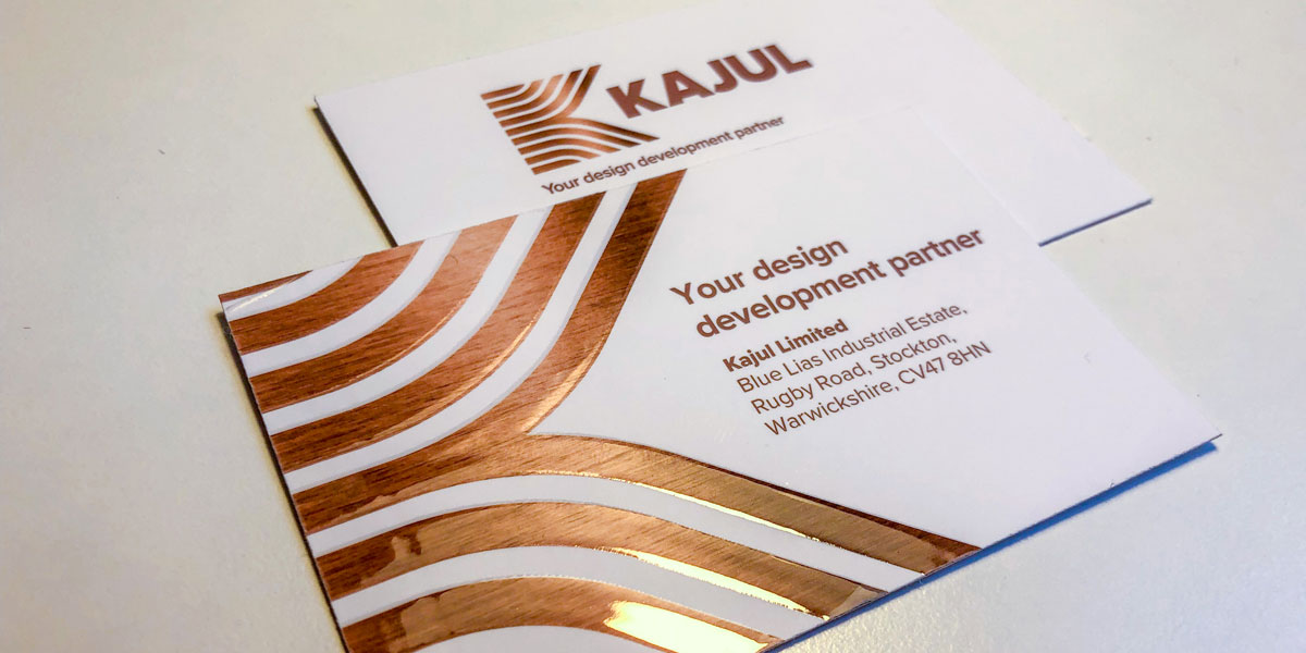 kajul_cards-twitter A white business card with copper geometric accents showcases KAJUL and the tagline Your design development partner. Created by Glued Limited, a leading branding agency in Warwickshire, the card includes contact details for their office on Rugby Road, Stockton.