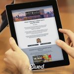 A person holds a tablet displaying a webpage for Per&You, offering virtual coaching in uncertain times. The screen features a header image, text about leadership support, and a podcast section. The Glued logo by the branding agency Warwickshire adorns the tablets bottom edge.