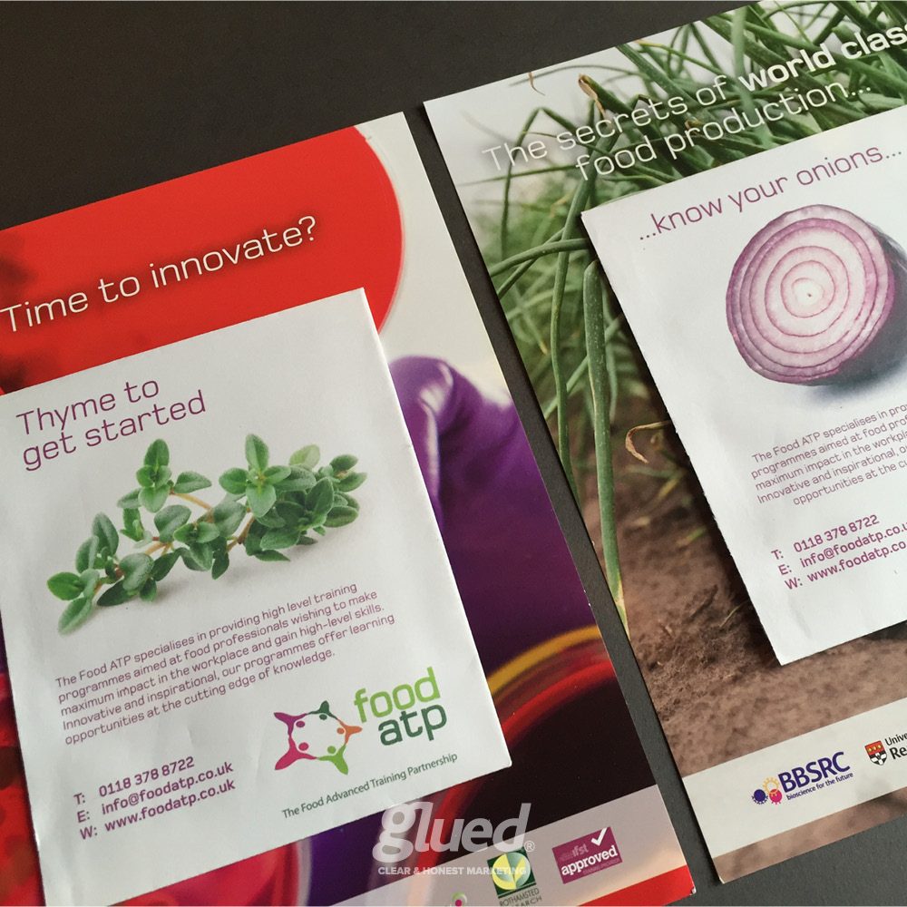 Glued Limited creative work: Packets of seeds labelled Thyme to get started and ...know your onions... rest on colourful brochures about food innovation, featuring herbs and onions, Food ATP branding, and promoting marketing campaigns to reach likeminded people.