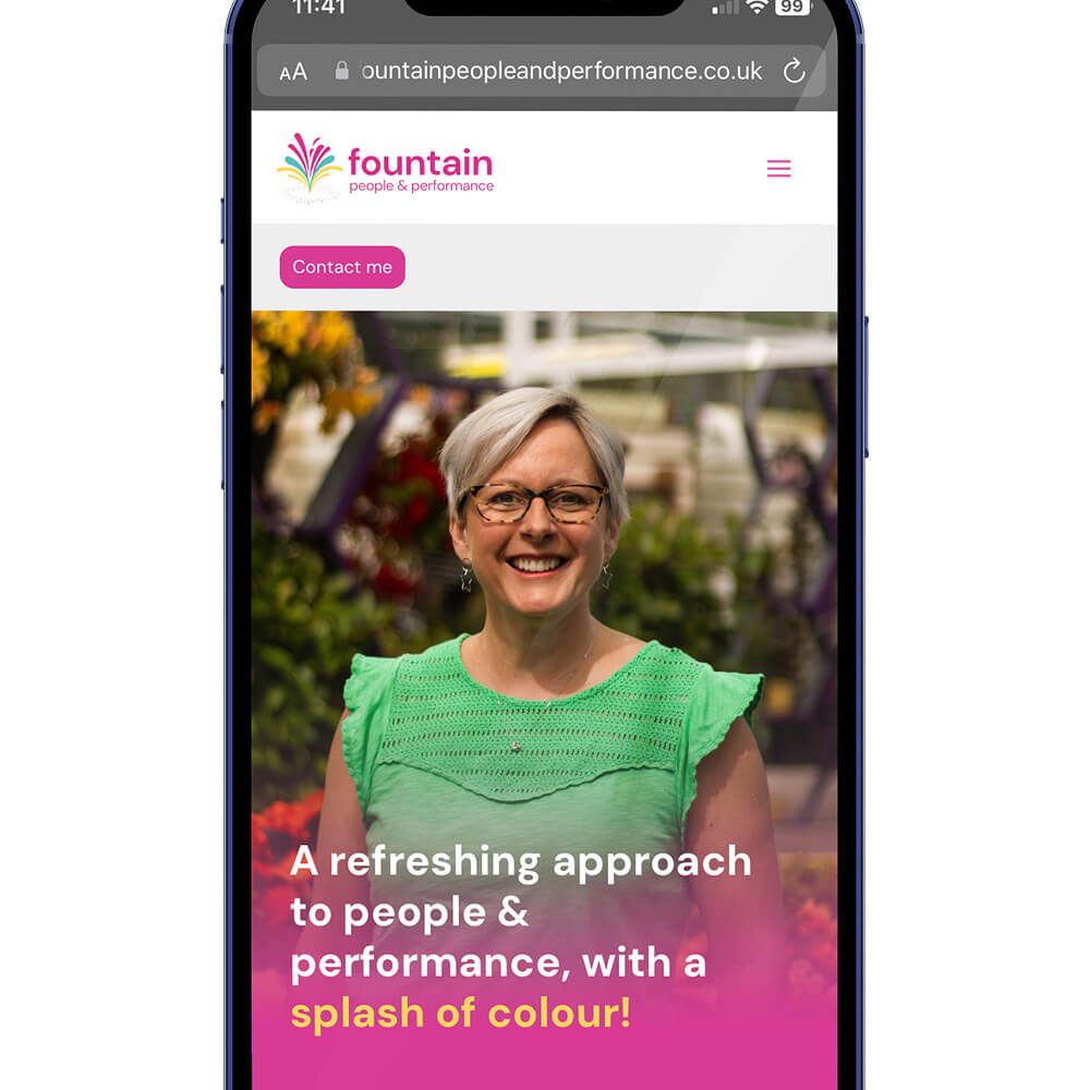 Glued Limited creative work: A smartphone screen displays a WordPress website design and build at affordable prices, featuring a smiling woman in glasses and a green top outdoors. The site header reads fountain people & performance, offering a refreshing approach with a splash of colour!.