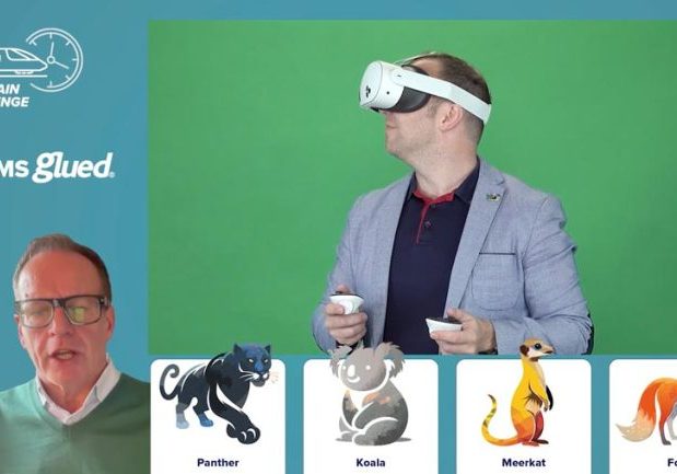 A man wearing a VR headset holds controllers in front of a green screen. In the corner, another man speaks via video call, joining Teams Glued for The Train Challenge. At the bottom, cartoon images of a panther, koala, meerkat, and fox are labeled.